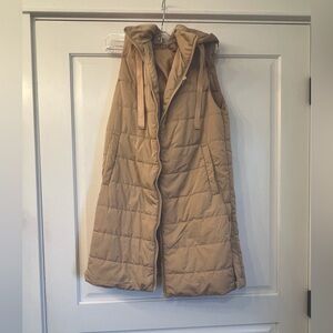 Khaki colored long vest.